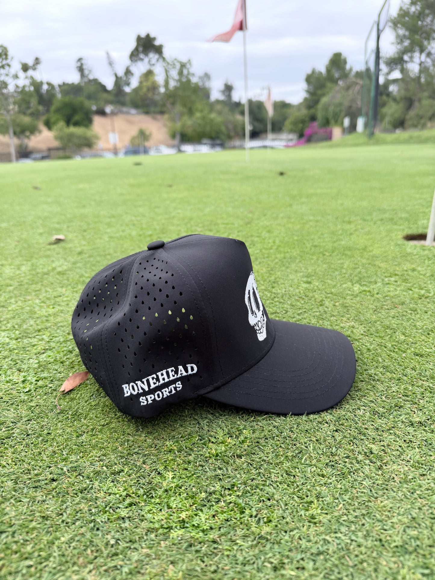 All black / green shirt bonehead hat