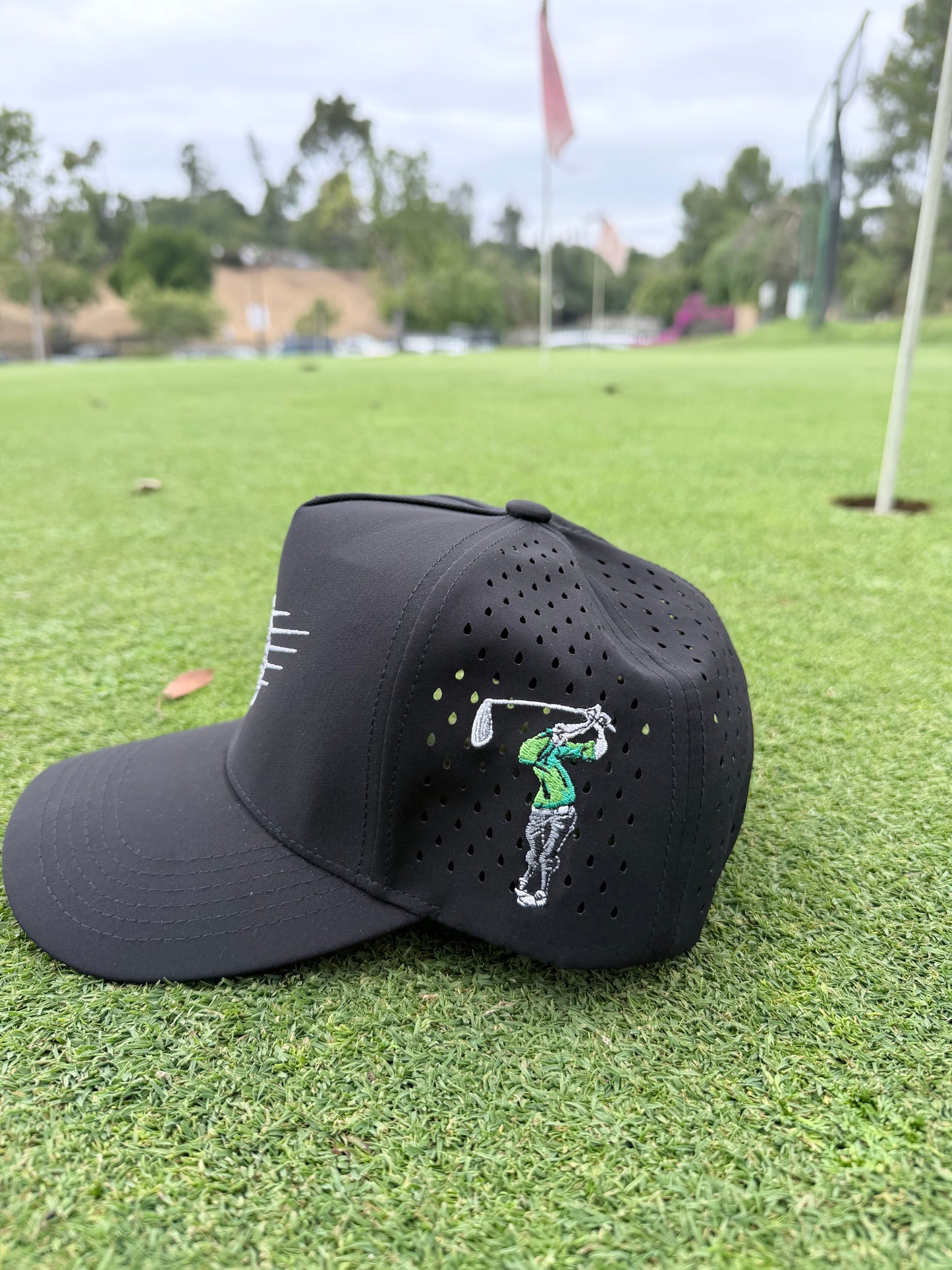 All black / green shirt bonehead hat